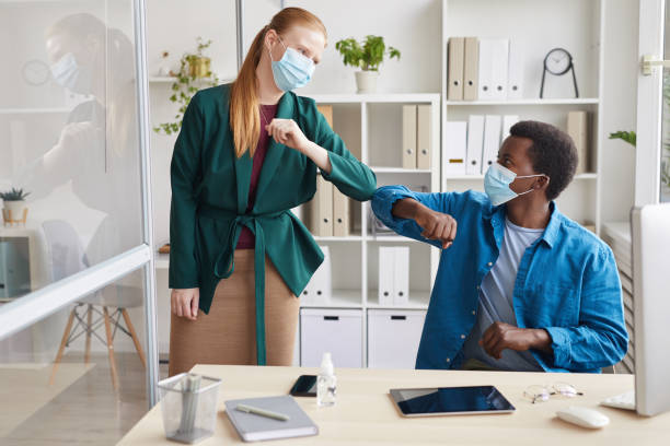 istock Greeting at Post Pandemic Office 1269902772