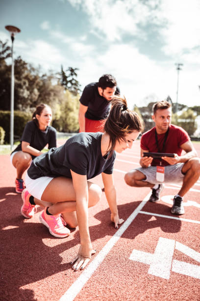 istock athletes reading to start on the track 1269904085