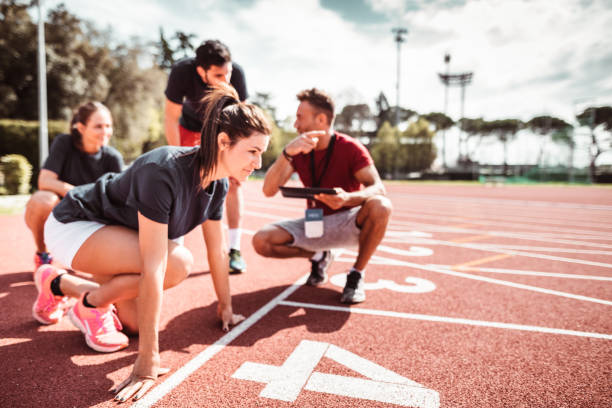 istock athletes reading to start on the track 1269904154