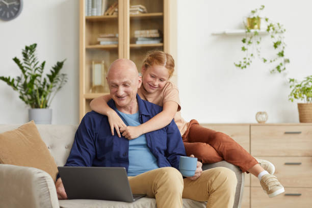 istock Senior Man Speaking by Video Call with Granddaughter 1269904236