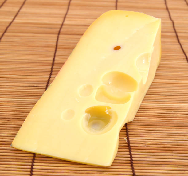 istock piece of cheese isolated on a white background 1269905330