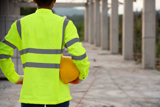 istock A worker in the uniform holding helmet for safety in the working construction site 1269912804