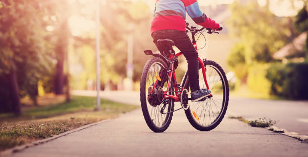 istock child on a bicycle in the evening 1269913248