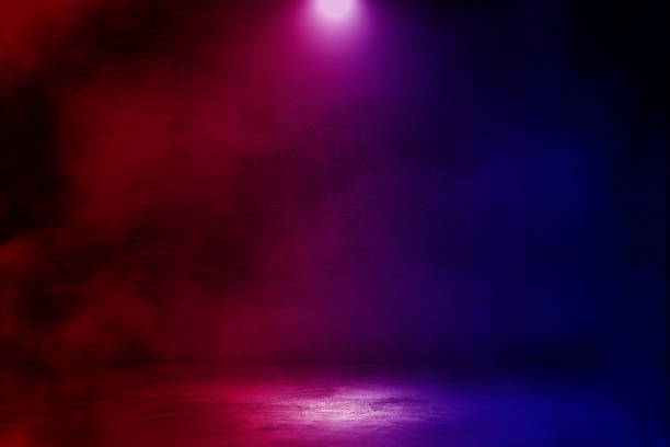 istock Studio dark room with smoke and lighting effect red and blue on concrete floor grunge background for product showing. 1269914461