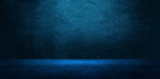 istock Studio room of Plaster concrete wall grunge texture background with blue lighting effect for product showing. 1269914552