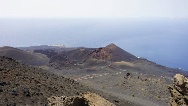 Volcano Teneguia panoramic view on the ocean background, Fuencaliente, La Palma, Spain Panoramic photo of Teneguia volcanic system in La Palma, Canary Islands, Spain, on a sunny day of August 2020. la palma canary islands photos stock pictures, royalty-free photos & images