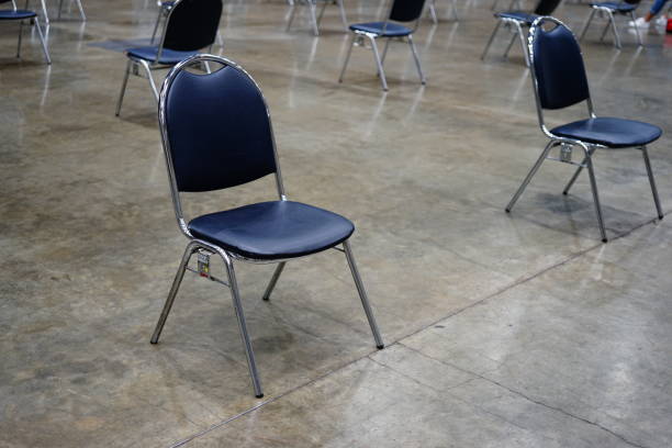 istock Row of chairs that was placed spreadly due to social distancing 1269916366