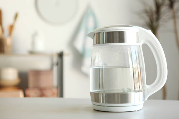 istock Pure water boils in an electric kettle on the table in the kitchen 1269919263