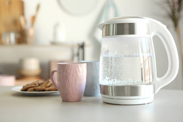 istock Pure water boils in an electric kettle on the table in the kitchen 1269919348