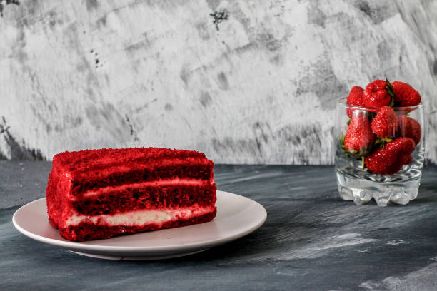 istock red velvet cake with strawberries on a beige plate 1269919372