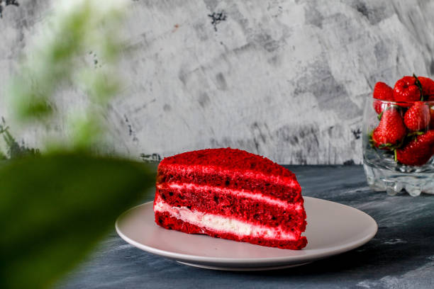 istock red velvet cake with strawberries on a beige plate 1269919379