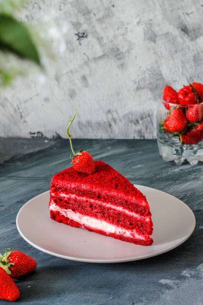 istock red velvet cake with strawberries on a beige plate 1269919425