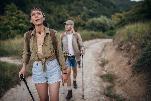istock Couple hiking together in nature 1269919436