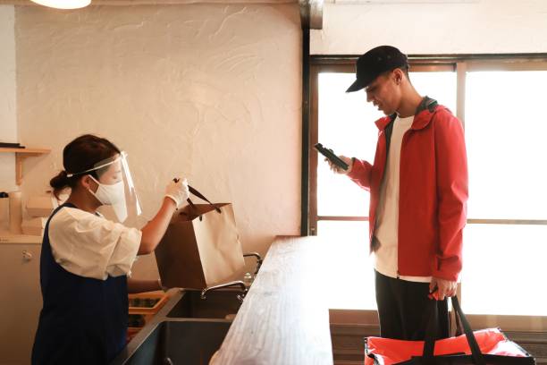 istock Receiving a take out food at restaurant 1269919579