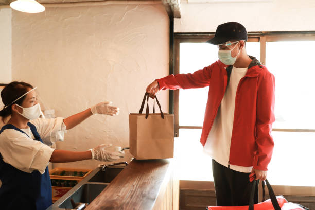 istock Receiving a take out food at restaurant 1269919597