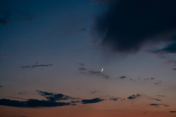 istock summer sky background with sunset sky and young moon 1269920718