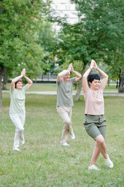 istock Teaching seniors to do balance exercise 1269922440