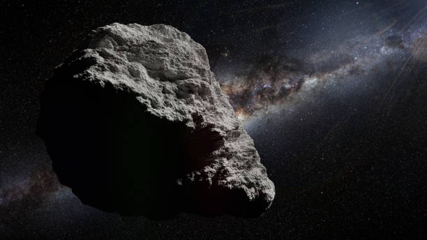 istock asteroid in deep space lit by the Milky Way galaxy 1269922471