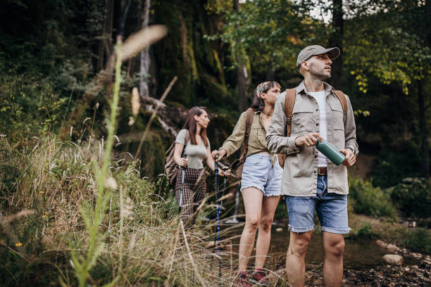 istock Friends hikers in forest 1269923348
