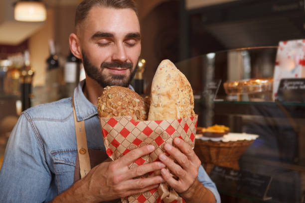 istock Male baker working at his bakery 1269923380