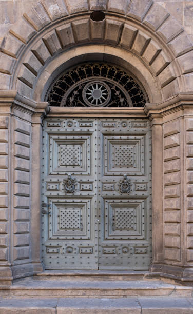 istock Old wooden door with ornaments 1269924701