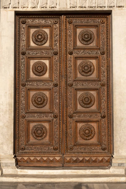 istock Old wooden door with ornaments 1269924728