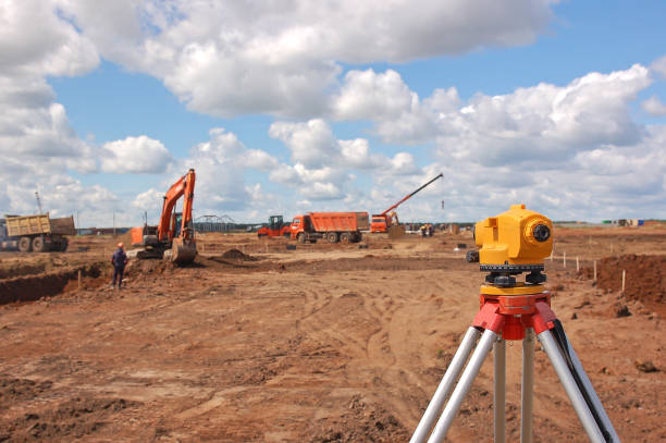 Surveying measuring equipment level theodolite on tripod Surveying measuring equipment level theodolite on tripod. Construction measuring tool earthwork stock pictures, royalty-free photos & images