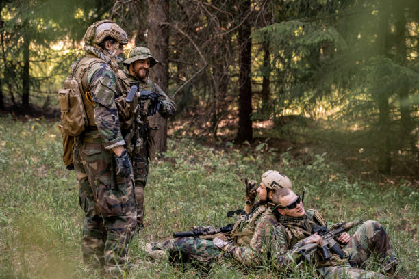 istock Soldiers resting in forest 1269925023