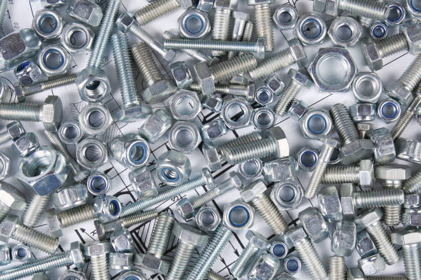 Hardware bolts and nuts top view background Hardware bolts and nuts top view background fastening photos stock pictures, royalty-free photos & images
