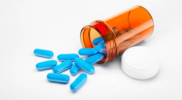 istock Blue pills with prescription bottle 1269925255