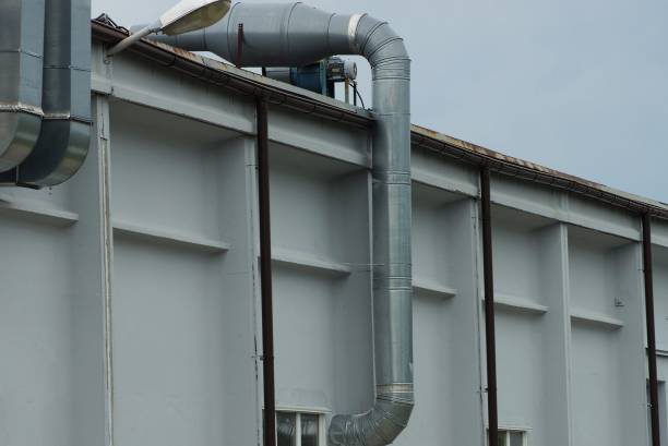 istock long gray iron fan pipes on white concrete wall 1269926514