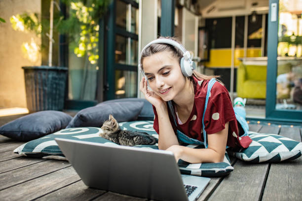 istock Female student at home using laptop in the cozy atmosphere 1269926668