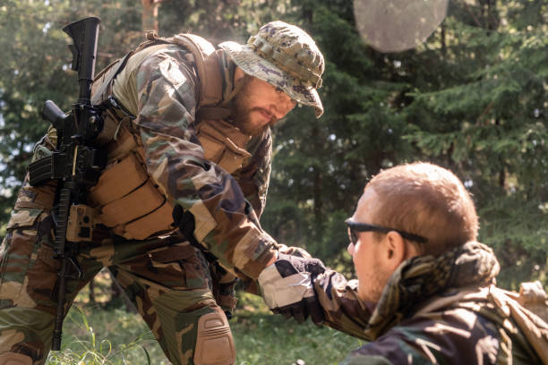 istock Picking military friend up off ground 1269926707