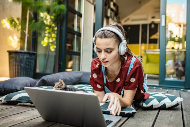 istock Female student at home using laptop in the cozy atmosphere 1269926763