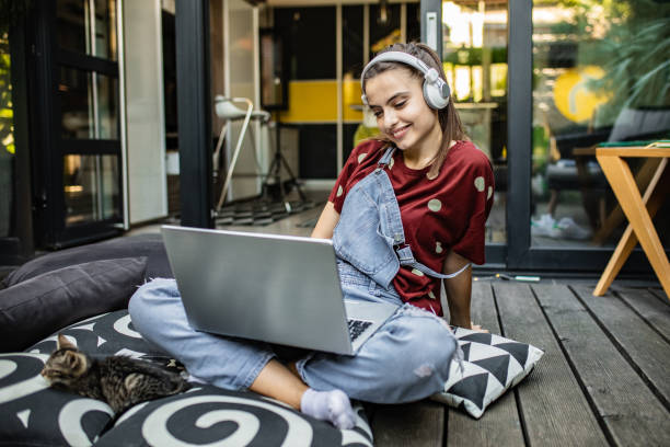 istock Female student at home using laptop in the cozy atmosphere 1269926850