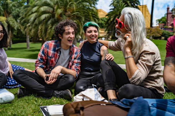 istock Professor lecturing to students in park 1269927077