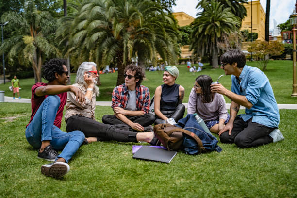 istock Professor lecturing to students in park 1269929036