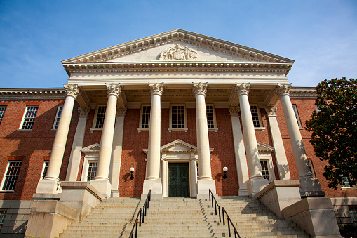 Entrance and the outside stairs of Maryland State Capitol (State house) located in Annapolis. Bug eye view photo features the historic building and the columns in front of it.