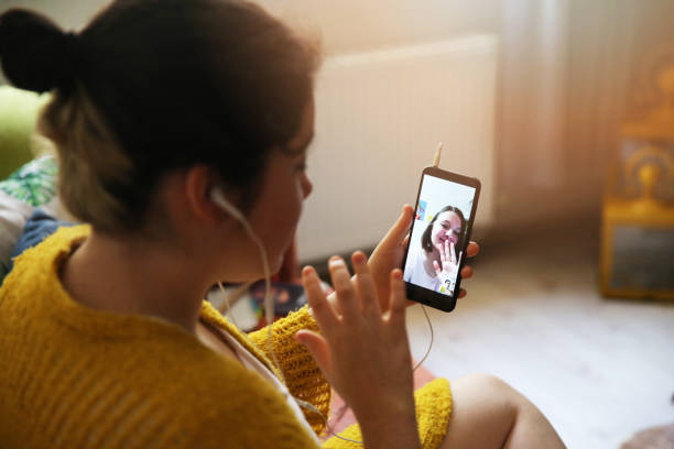 Top view of woman calling a friend with mobile phone device stock photo