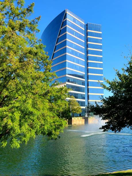 istock Building zframed by lake and trees 1269930873