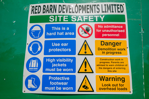 Construction Site in Royal Tunbridge Wells, England. This safety notice spells out the safety regulations that must be adhered to under the eye of Red Barn Developments.