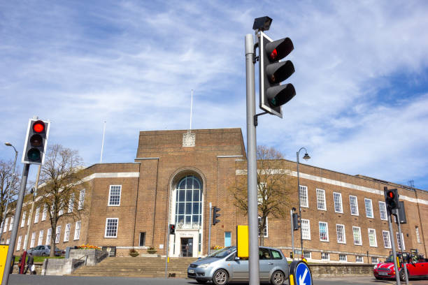 Tunbridge Wells Town Hall in Kent, England. This is the public administrative building for the town of Royal Tunbridge Wells and has at various points housed the gallery, library and museum. It was built in 1939 in the neo-Georgian style. People and car number plates can be seen.