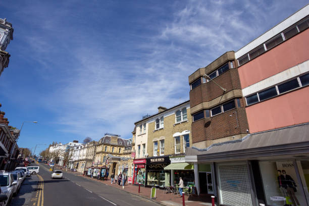Several people and stores can be seen along Mount Pleasant Road in Royal Tunbridge Wells, England