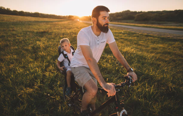 istock Father and son cycling together 1269936376