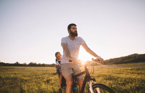 istock Father and son cycling together 1269936395