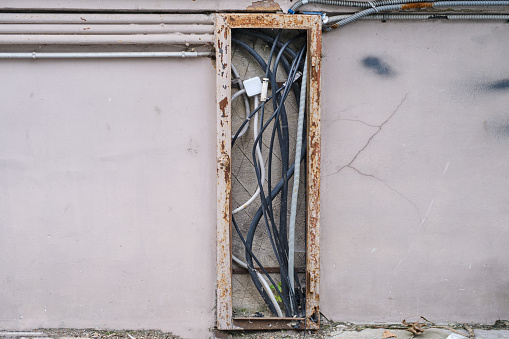 Old electrical wiring on the front of the building