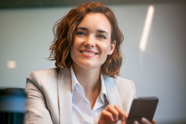 istock Businesswoman using smart phone 1269941203