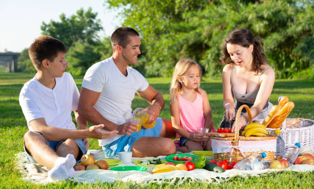 istock Cheerful family picnicking 1269942225