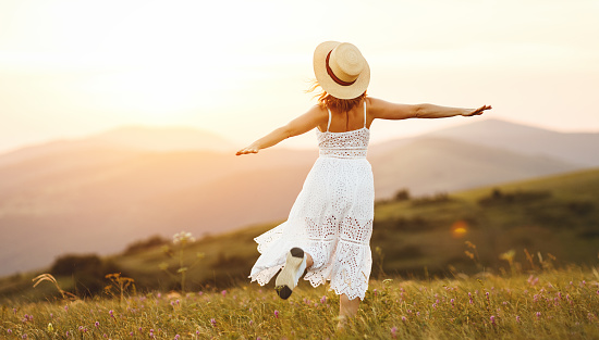 Happy Woman Dancing And Spinning With Her Back On Sunset In Nature Stock  Photo - Download Image Now - iStock