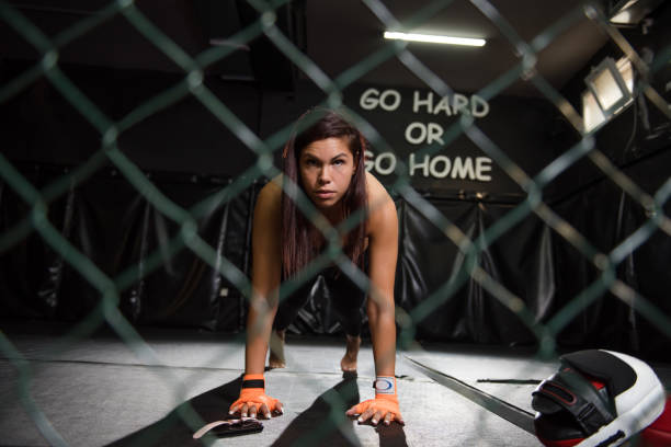 istock Fit woman working on abdominal muscles doing plank exercise, core workout at the gym 1269951376